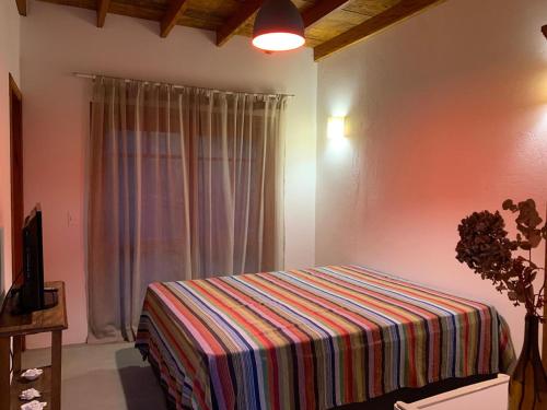 Ένα ή περισσότερα κρεβάτια σε δωμάτιο στο Casa Mescla