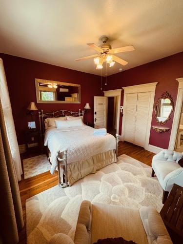 a bedroom with two beds and a ceiling fan at The Gibson Mansion Bed and Breakfast in Missoula