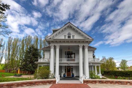 a large white house with columns at The Gibson Mansion Bed and Breakfast in Missoula