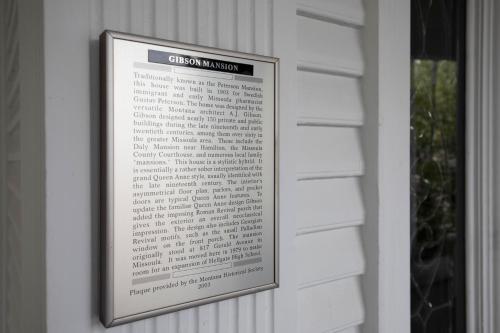 a framed sign on a wall in a window at The Gibson Mansion Bed and Breakfast in Missoula