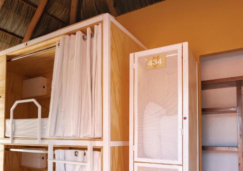 a room with a bunk bed with a window at Casa Pepe in Sayulita