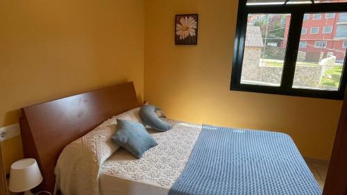 Postel nebo postele na pokoji v ubytování Portosin Casa Preciosa con vistas a la Ría de Muros y Noia