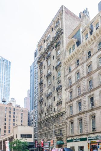 a large building in a city with tall buildings at Studios in New York in New York