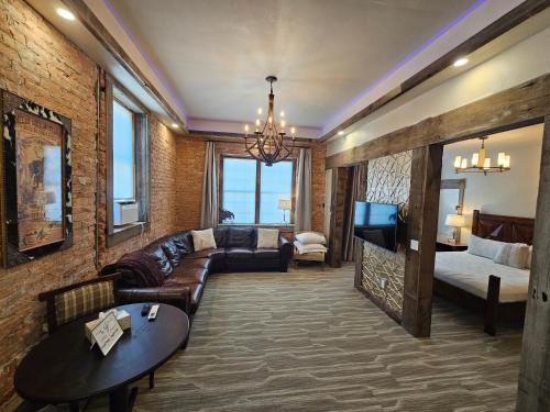 a living room with a couch and a table at Eaglescape Suites and Event Center in Miles City