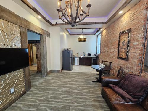 a living room with a couch and a table at Eaglescape Suites and Event Center in Miles City