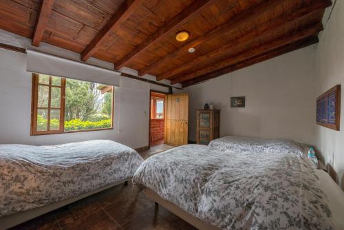 Ένα ή περισσότερα κρεβάτια σε δωμάτιο στο Hacienda El Rejo