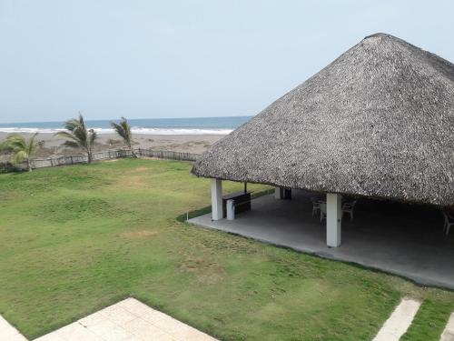 an image of a hut with a grass roof at Casa Margarita Hotel And Paradise in Las Lisas