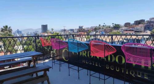 a group of chairs sitting on top of a building at Cabaña DW in Tijuana