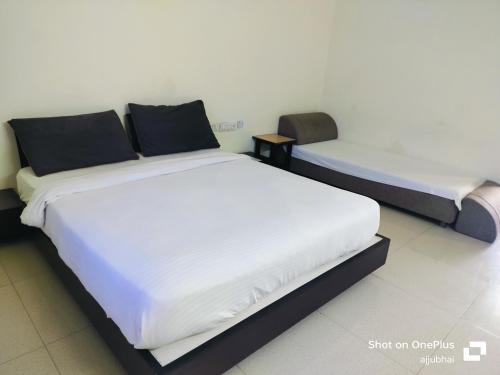 Postel nebo postele na pokoji v ubytování hotel Sun N Step Club