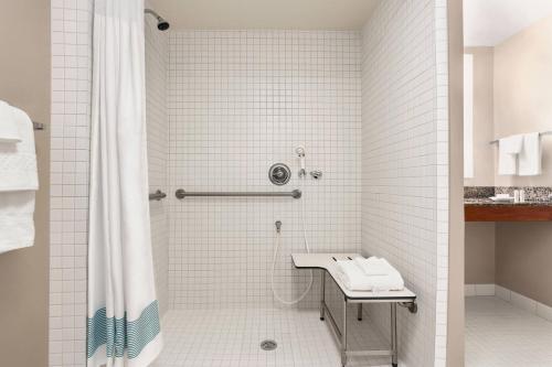 a bathroom with a shower and a sink at TownePlace Suites by Marriott Springfield in Springfield