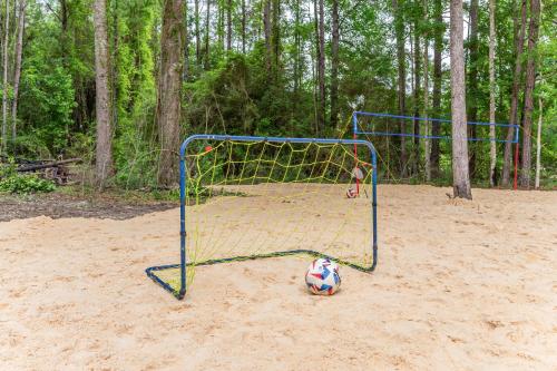 a soccer goal with a ball in the sand at Westville Pines Cabin in Westville
