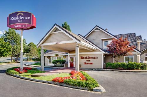 a restaurant with a sign in front of a building at Residence Inn Seattle North/Lynnwood Everett in Lynnwood
