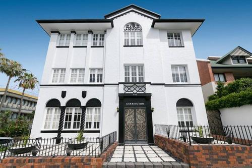 a white building with a door in front of it at The Carrington Manor in Brisbane