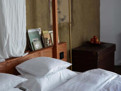 a bedroom with a bed with white pillows and a mirror at LATERAL - Vacation STAY 36594v in Shiojiri