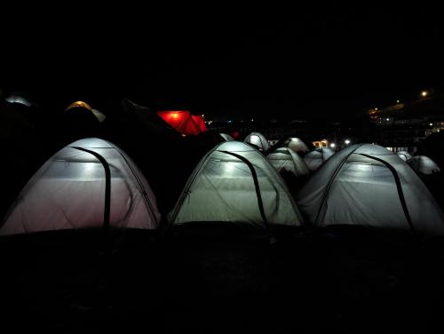 a group of tents in the dark at night at Kedar Tent House in Kedārnāth