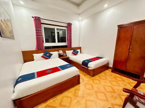 Ένα ή περισσότερα κρεβάτια σε δωμάτιο στο Thanh Quyen hotel
