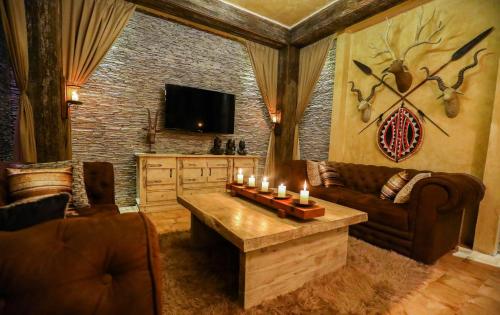 TV a/nebo společenská místnost v ubytování Pramod House Of Classics