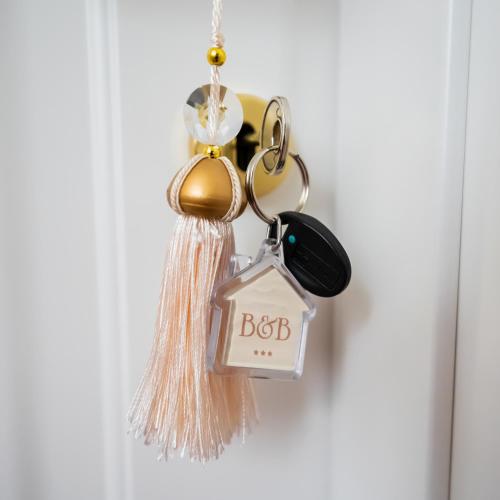 a bunch of keychains hanging on a door at SWEET HOME DELUXe in Rosolini