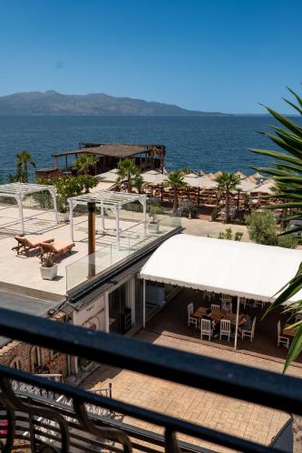 a view of the ocean from the balcony of a resort at Sunset Aparthotel in Sarandë