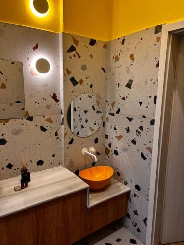 a bathroom with a sink and a mirror at Modern apartment Downtown in Rethymno Town