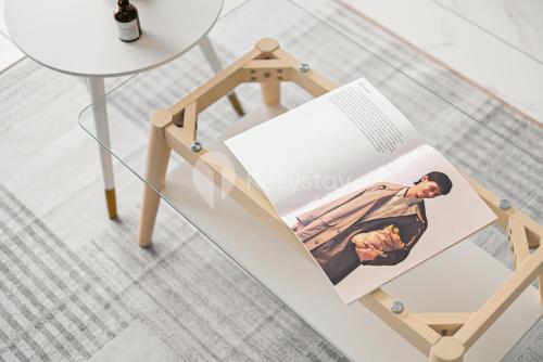 a photo album on a stand next to a table at Mosaic by Kozystay - BSD in Tangerang