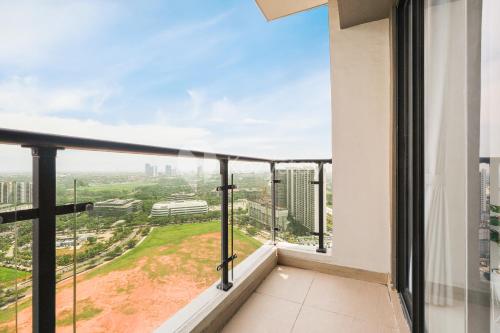 a balcony with a view of a city at Mosaic by Kozystay - BSD in Tangerang