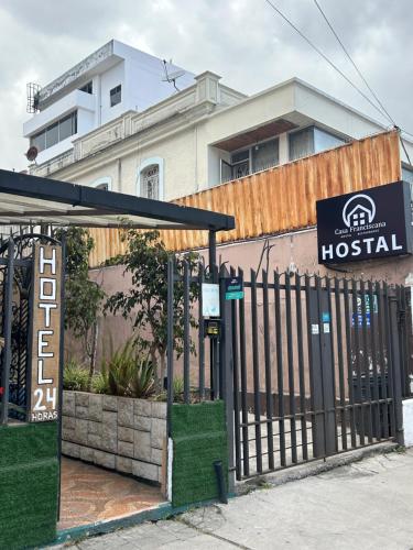 a wrought iron gate in front of a hospital at Hostal CASA FRANCISCANA in Quito