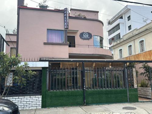 a building with a gate in front of it at Hostal CASA FRANCISCANA in Quito