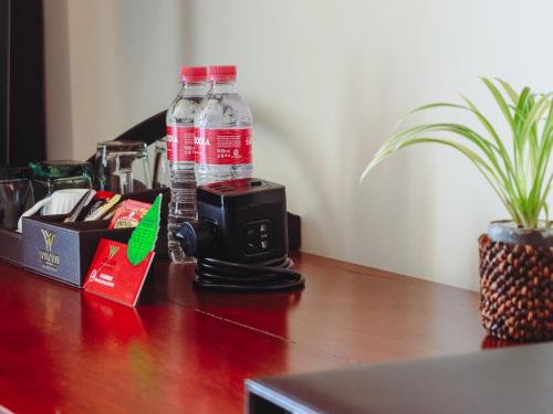 a bottle of water sitting on top of a table at Poulo Wai Hotel & Apartment in Phnom Penh