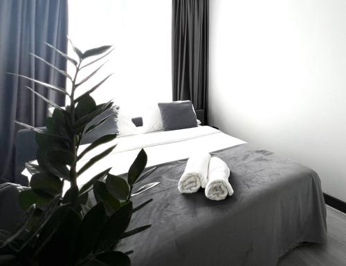 Кровать или кровати в номере Apartments VIP AVALON