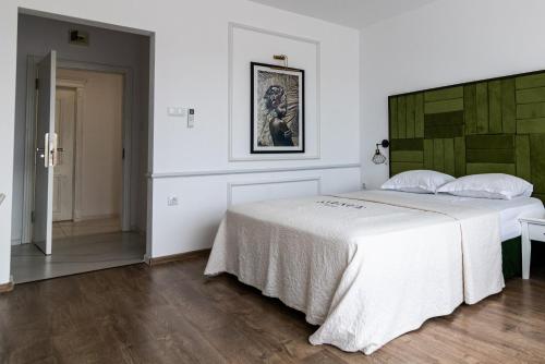 מיטה או מיטות בחדר ב-Hotel AVENUE
