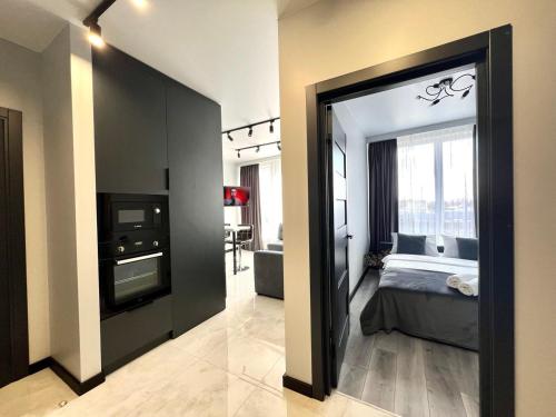 Кровать или кровати в номере Apartments VIP AVALON