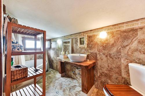 a bathroom with a sink and a bunk bed at Azure Coast Seafront Retreat in Mola Kalyva