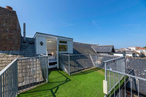 a view of the balcony of a house at Modern Sea View Apartment in Aberdyfi