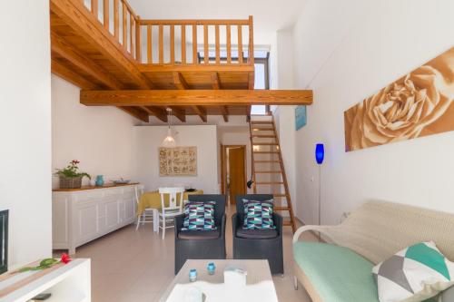 a living room with a couch and a table at Apartment Voltor 2 C By SunVillas Mallorca in Pollença