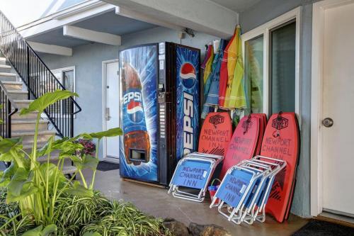 a group of surfboards are lined up on a porch at Newport Channel Inn in Newport Beach