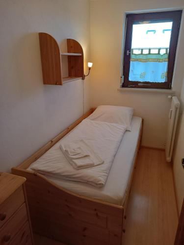 Ένα ή περισσότερα κρεβάτια σε δωμάτιο στο Haus Alpenland/Schneider