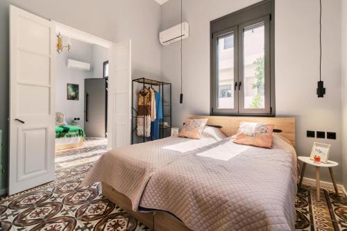 a bedroom with a bed and a window at Quattro Zie in Rhodes Town
