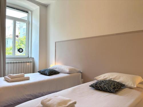 Posteľ alebo postele v izbe v ubytovaní Flat Belpoggio 13