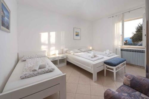 Posteľ alebo postele v izbe v ubytovaní Apartment in Rabac 16817