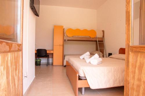a bedroom with two bunk beds in a room at Rifugio La PRINCIPESSA in Morano Calabro