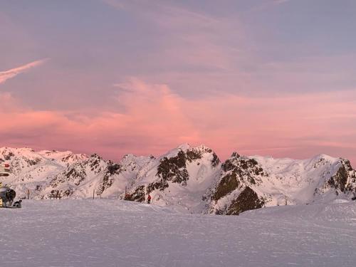 a snow covered mountain range with mountains in the background at studio, 2 personnes, Les Balcons de Recoin in Chamrousse