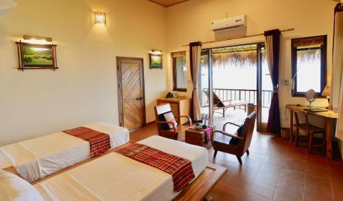 Letto o letti in una camera di Puluong Retreat