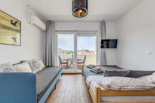 Posteľ alebo postele v izbe v ubytovaní Trogir Downtown Apartments