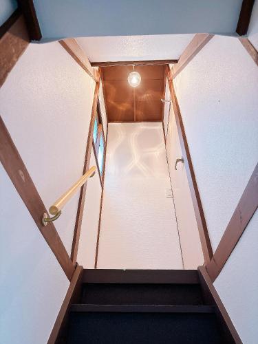 an overhead view of a staircase in a room with a ceiling at Ikebukuro area, two layer house, double subway,3 min walk to stn, 双地铁车站步行3分 直达新宿 涩谷 银座 池袋 皇居 最大6人 in Tokyo
