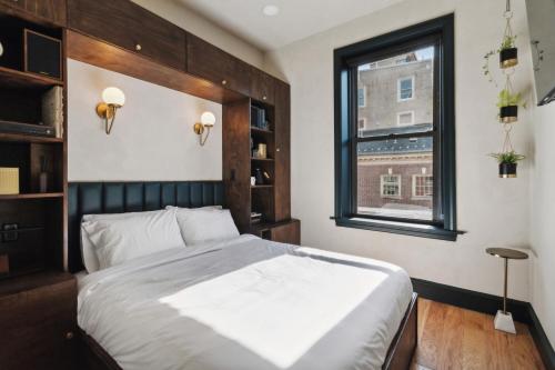 a bedroom with a large bed and a window at Society Hill Hotel in Philadelphia