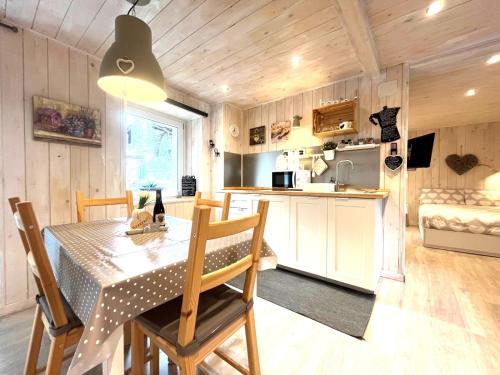 a kitchen and dining room with a table and chairs at Due cuori e... un Loft nel cuore antico di Aosta in Aosta