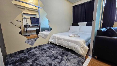 Кровать или кровати в номере Nesting Lounge One at Santorini Condotel