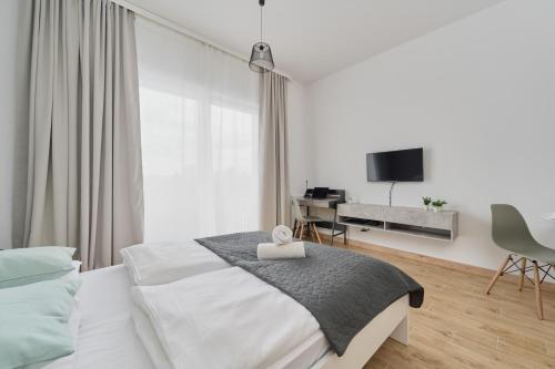 Posteľ alebo postele v izbe v ubytovaní Modern Studio Słonimskiego with Balcony by Noclegi Renters