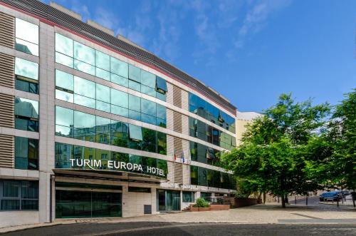 a building with a sign on the side of it at TURIM Europa Hotel in Lisbon